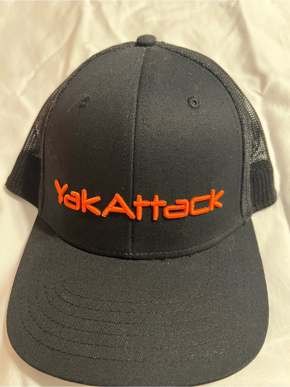 YakAttack Men's Black Trucker Cap with Orange Logo